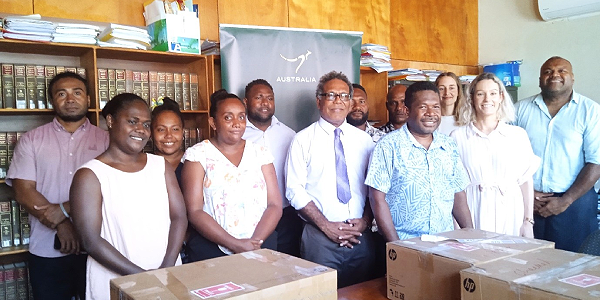 SILRC staff with MJLA PS George Hoa’au, SILRC Chairman Philip Kanairara, Australian High Commission Counsellor for Governance and Stability, Ms Nicole Smith and A2J Program staff with some of the boxes of new computers.