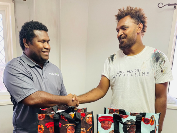 Bulk Shop HR Manager David Upwe appreciating Jackson’s work. Photo, Bulk Shop.