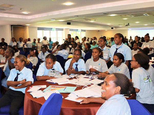 Women and girls at the ICT event are inspired by the presentations. Photo, AHC.