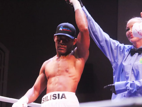 Lemuel Silisia gets his hand raised after securing his third professional victory, all of which have come by knockout. Photo by Zac Lowe.