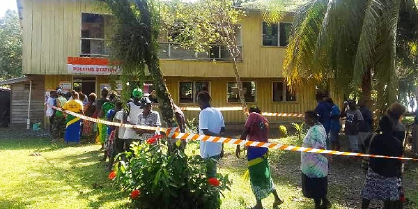 Voters queuing up to cast their ballots.