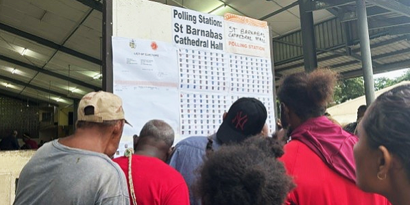 Central Honiara voters check for their names on the list at the St Barnabas Polling station, prior to casting their votes.
