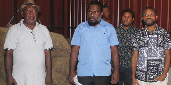 From left: Deputy Chairman of CEMA Board Belani Tekulu, Malaita Provincial Premier Elijah Asilaua and other Members of the Malaita Provincial Assembly inside CEMA copra shed in Malu’u. Photo by SOLOMON LOFANA.