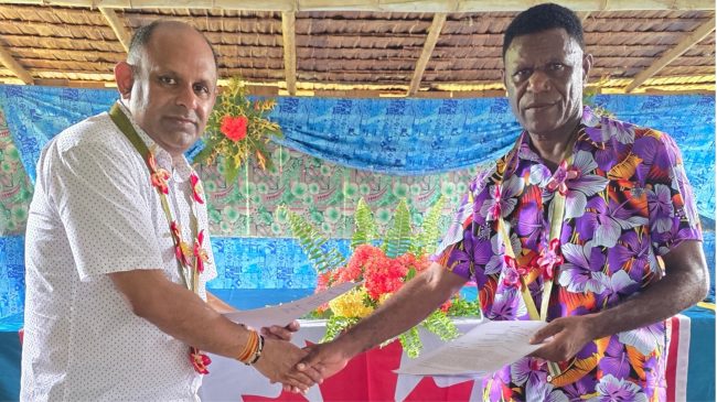CITREC Chair Ashwant Dwivedi and East Central Guadalcanal MP Lazarus Alfred Rimah congratulate each other during the signing of the agreement at Aola. Photo- CITREC