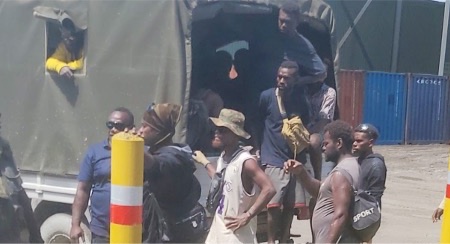 Illegal miners ready to leave the Gold Ridge site on vehicle