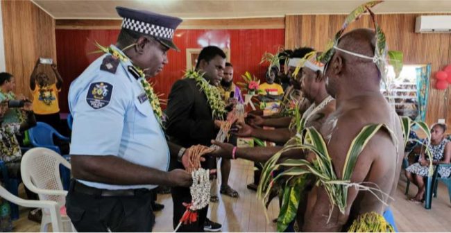Leaders of the Malaita Community in Taro presenting a Tafuliae (shell money) to Choiseul Premier Harrison Pitakaka and the Choiseul Provincial Police Commander