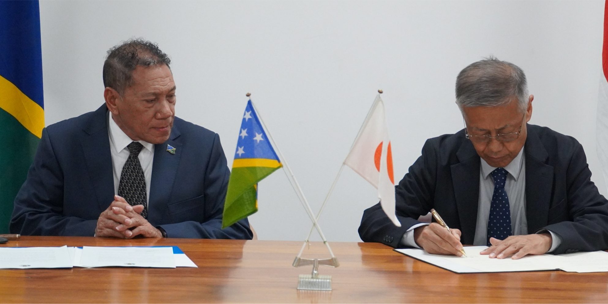 MFAET Minister Hon Peter Shanel Agovaka and Japan Ambassador H.E Miwa Yoshiaki signed the documents. Photo by Lachlan Shyves Eddie