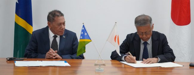 MFAET Minister Hon Peter Shanel Agovaka and Japan Ambassador H.E Miwa Yoshiaki signed the documents. Photo by Lachlan Shyves Eddie