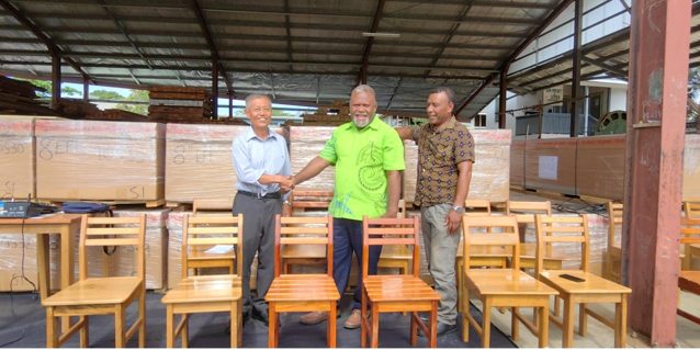 Ambassador Miwa Yoshiaki (first from left) shaking hands with MoFR Minister Tagini. Looking on is PS Richard Raomae. At their back are the boxes of sawmills