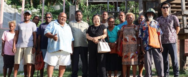 Cr Yeo (center) and her son (far right) with Ilia School teachers and community leaders