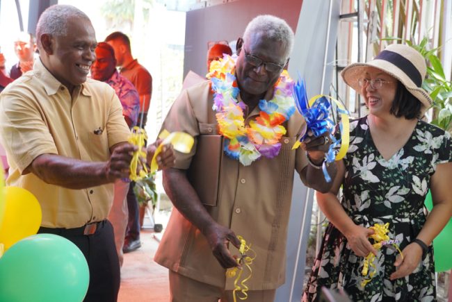 Cutting the ribbon for the official opening of the STL office
