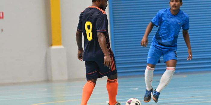 Jeffery Bule of Futsal G.C with the ball while a Kukstaon players looks on. photo by Floyd Terry.