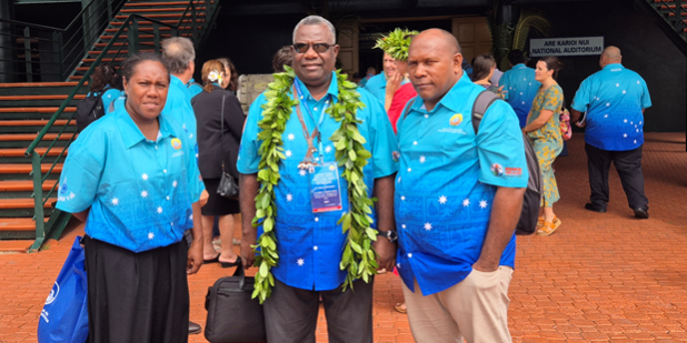 Minister Bradley Tovosia (c) flanked by Director Water Resources Richard Molea and EPS Margret Limairadi