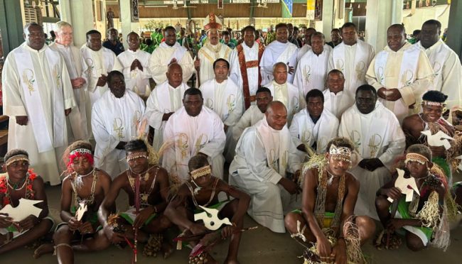 Newly ordained Deacon Ramoga with Archbishop Christopher Cardone, Priests, Deacons and Dancers infront of the Holy Cross Cathedral
