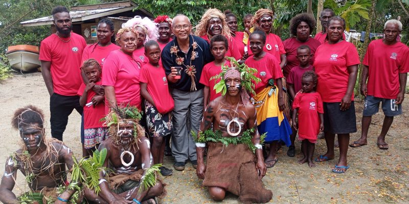 Nusa Mahiri Warriors and Community Members with ADRA Director Leyn E Gantare take photo after the welcoming ceremony.