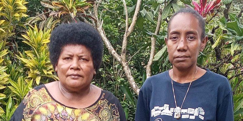 Outgoing MPCW president Martha Rurai left poses with Newly MPCW President Rebecca Awa