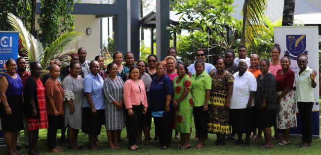 Participants and officials pose for a group photo during the first day of the training program