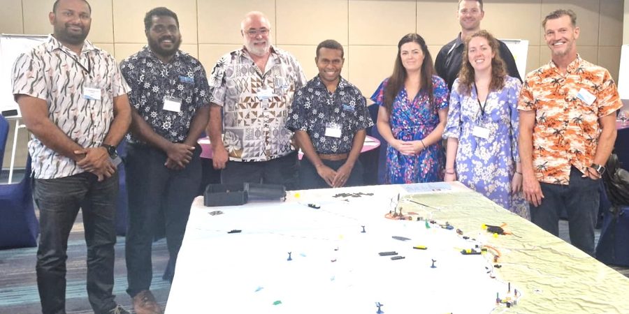 A goup photo with the tabletop exercise map