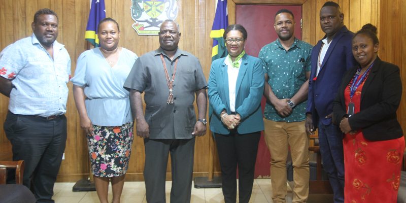 Acting PM Bradley Tovosia flanked by SICCI board members and staff of OPMC
