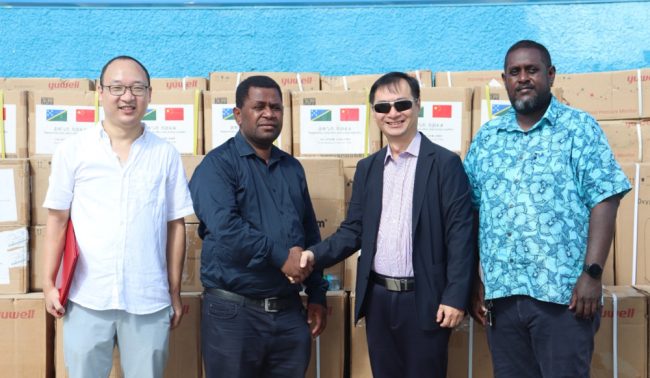 Chinese Ambassador H.E Cai Weiming handover the medical equipment to Health Minister Dr Paul Bosawai