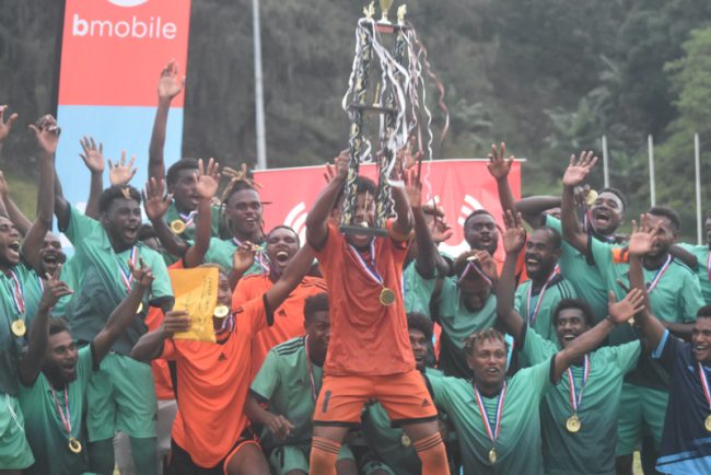 East Central Guadalcanal FC Celebrates their victory with their trophy. Photo by Raymond Hulanga.