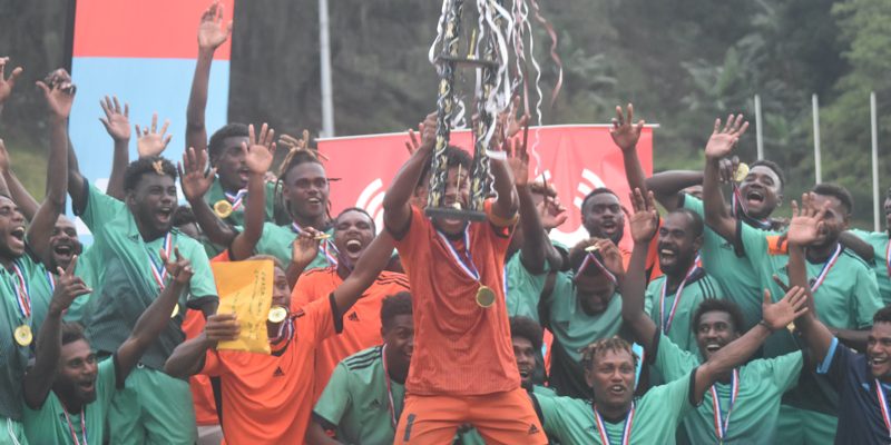 East Central Guadalcanal FC Celebrates their victory with their trophy. Photo by Raymond Hulanga.
