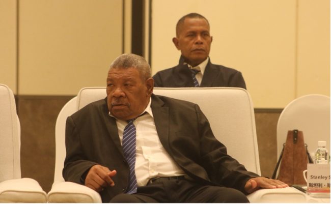 Hon. Stanley Siapu (MPA), Premier for Makira Ulawa Province. Seated at the back is Mr. Peter Trena, Provincial Secretary for Makira Ulawa Province