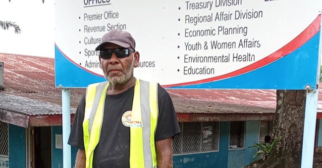 Max Bobby in front of Malaita province Government sign board.photo.Solomon lofana