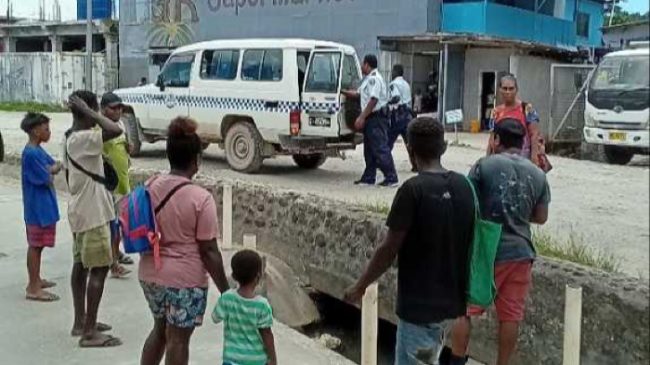 Members of the public watched as the suspect was led away by police