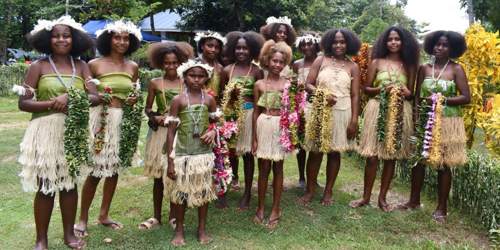Rural girls in traditional dress performing cultural dance