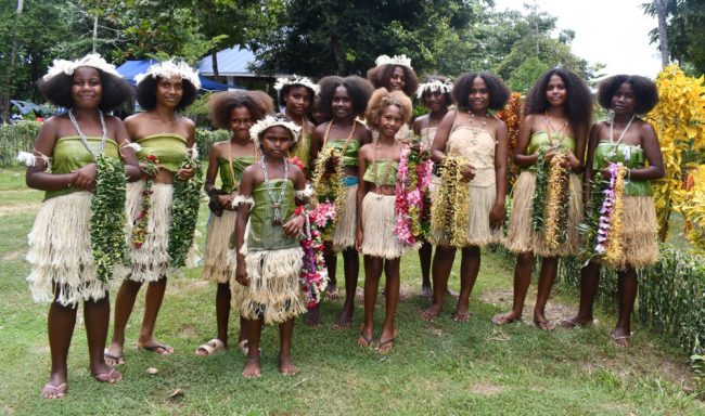 Rural girls in traditional dress performing cultural dance