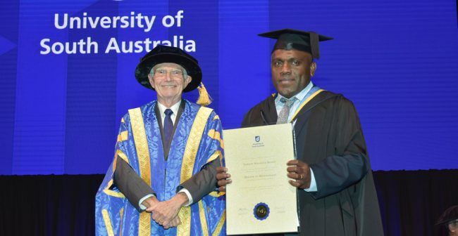 Samson Bisafo receiving his masters testamur during graduation in Adelaide