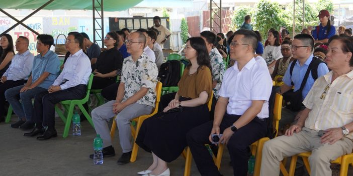The Jiangmen delegation and officials from the Chinese Embassy watching cultural dances put on by students