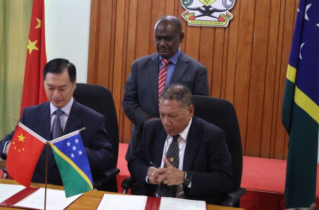Ambassador Cai Weiming and Foreign Affairs Minister Peter Shanel Agovaka signed the Agreement witnessed by PM Manele