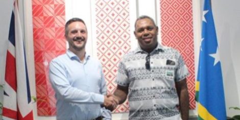 High Commissioner Thomas Coward shaking hands with Permament Secretary Dr Chris Vehe of MMERE-1