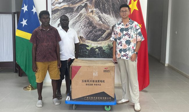 CDO John Ngili on the left on receiving the donation.