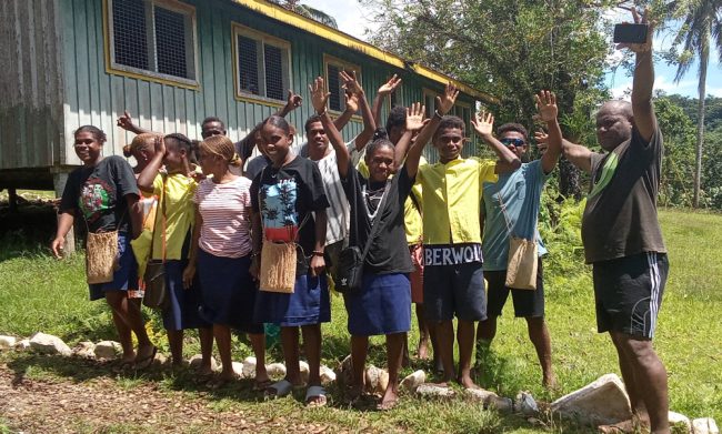 Laugwata form 3 students with their teachers celebrate after the final exam yesterday.