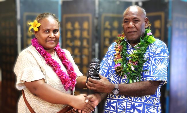 MAL EPS presenting a gift on behalf of MAL executive to outgoing DoBSI Director Francis Tsatsia.