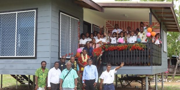 Selwyn College School Principal Edwin Rogemana, second from Right, and Deputy Principal Tito Mamani with official guests and students celebrating the opening of the school’s two staff houses
