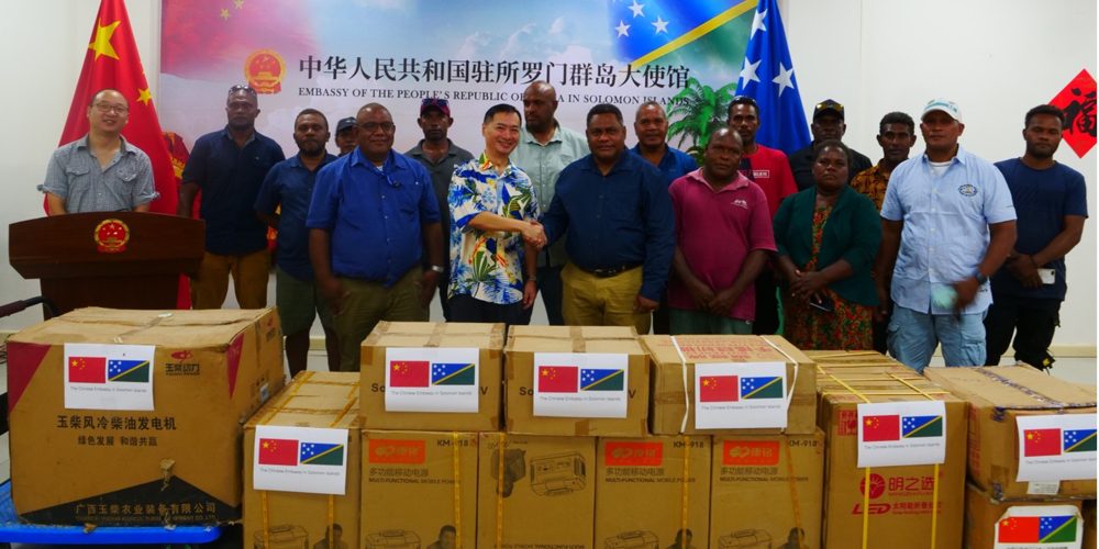 The Chinese Ambassador Cai Weiming shaking hands with the MP for Fataleka Constituency Rexon Annex Ramofafia