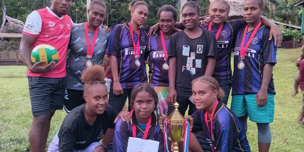 The Ladoa Black volleyball team proudly pose and display their winning trophy and prizes. Photo Lesley Sanga