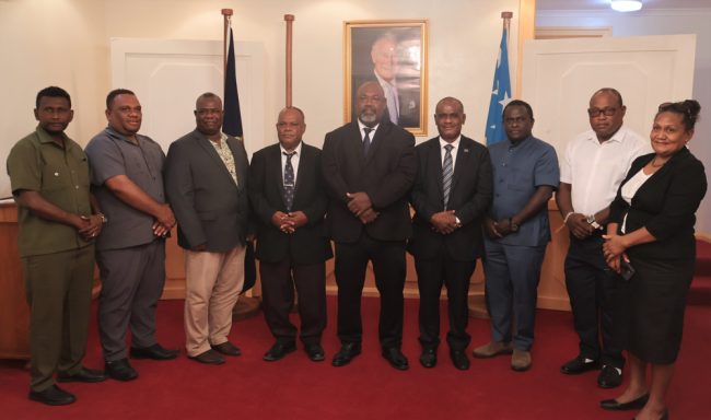 Group photo of Prime Mnister Manele MP, DPM Tovosia MP, Ministers and Caucus Deputy Chair congratulating Minister Sade (centre) after taking his Oath