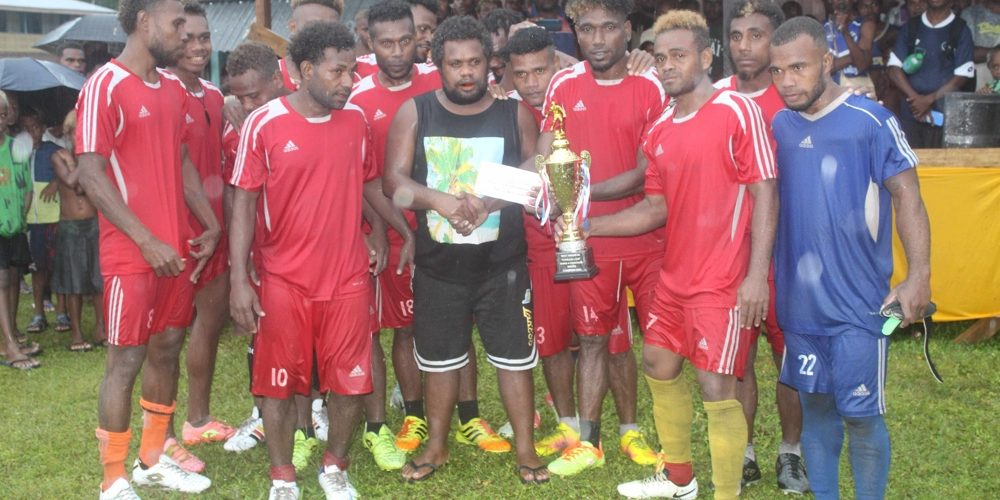2024 Tuasulia Christmas soccer tournament champion DN FC showing their wining trophy and cash prize.Photo by Solomon Lofana