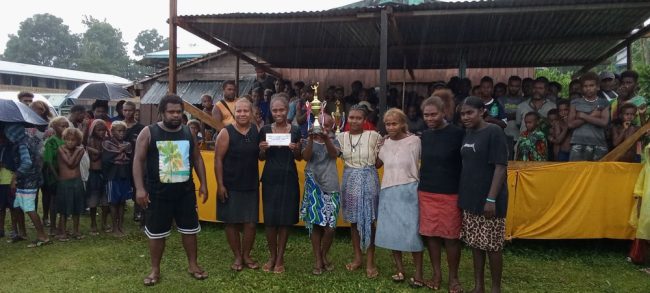 2024 Tuasulia Christmas volley ball tournament champions DS team pose with their prize and trophy