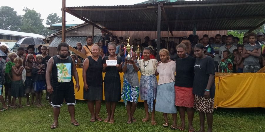 2024 Tuasulia Christmas volley ball tournament champions DS team pose with their prize and trophy