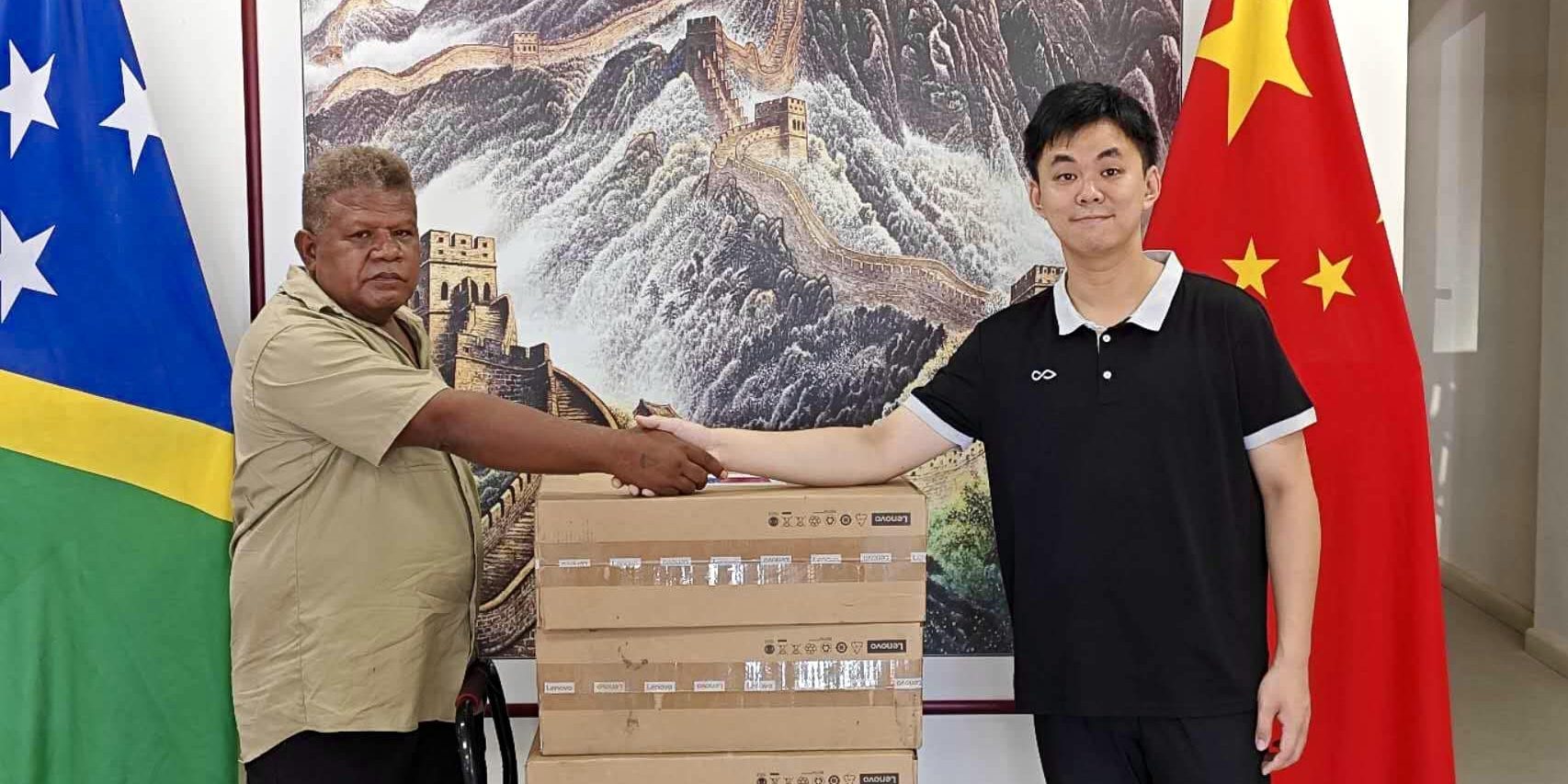 Central Kwara’ae Constituency Project Officer Sam Ilimanu (left) receives donated items from a Chinese Embassy official at the Chinese Embassy in Honiara. Photo supplied.
