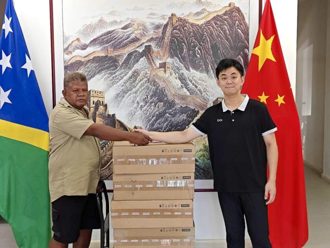 Central Kwara’ae Constituency Project Officer Sam Ilimanu (left) receives donated items from a Chinese Embassy official at the Chinese Embassy in Honiara. Photo supplied.