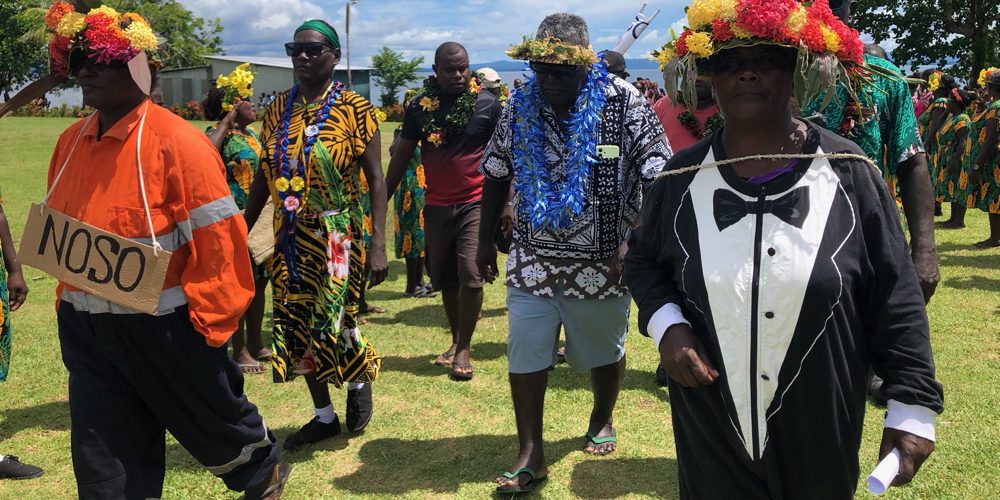 MP Gina being led to the stage