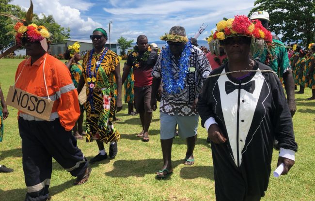 MP Gina being led to the stage