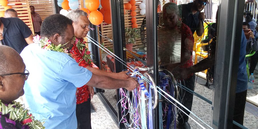 Malaita Province Premier Elijah Asilau with solomon post Board chairman James Apania cutting the ribbon to officially open the new solomon post office in Auki. Photos. SOLOMON LOFANA
